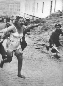 Jewish woman being chased by youth armed with clubs